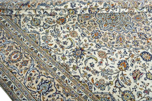 Close-up detail of 2000s Kashan rug from Iran / Persia showing Wool weave
