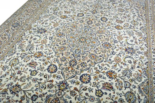 Backside of handmade 2000s Kashan rug showing knot structure and weave density