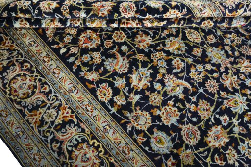 Close-up detail of 2000s Kashan rug from Iran / Persia showing Wool weave
