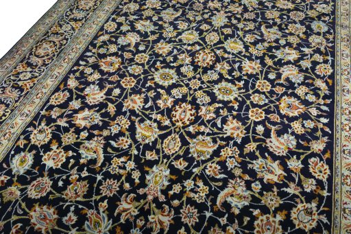 Backside of handmade 2000s Kashan rug showing knot structure and weave density