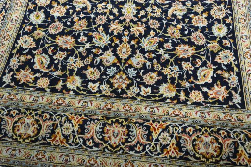 Close-up detail of 2000s Kashan rug from Iran / Persia showing Wool weave