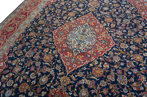 Backside of handmade 2000s Kashan rug showing knot structure and weave density