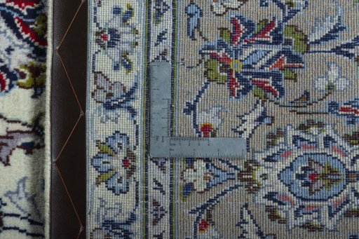 Backside of handmade 2000s Kashan rug showing knot structure and weave density