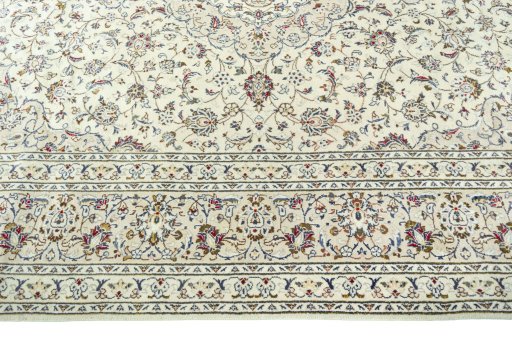 Corner detail of 2000s Kashan rug showing border pattern and Wool pile