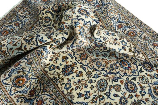 Surface texture of 2000s Kashan rug with natural Wool and intricate pattern