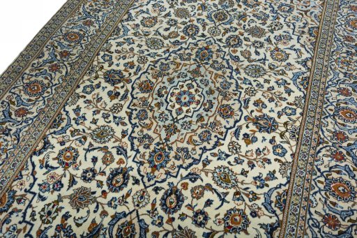 Backside of handmade 2000s Kashan rug showing knot structure and weave density