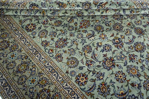Close-up detail of 2000s Kashan rug from Iran / Persia showing Wool weave