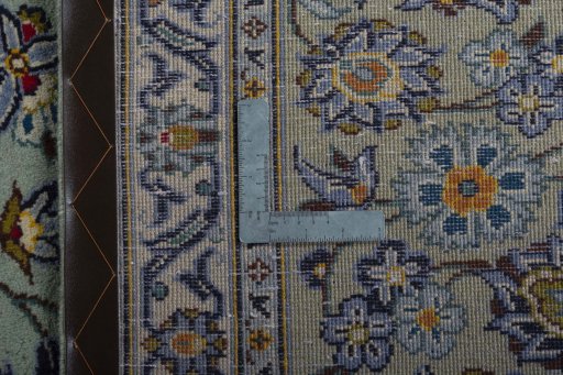 Backside of handmade 2000s Kashan rug showing knot structure and weave density