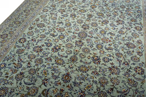 Backside of handmade 2000s Kashan rug showing knot structure and weave density