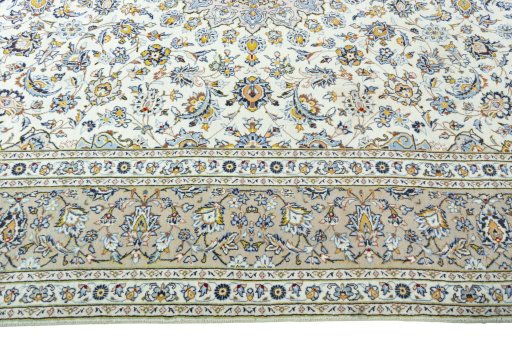 Corner detail of 2000s Kashan rug showing border pattern and Wool pile