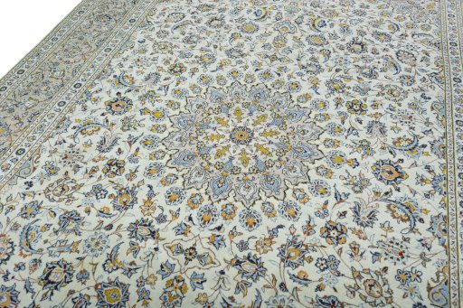 Backside of handmade 2000s Kashan rug showing knot structure and weave density
