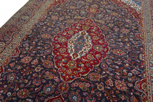 Backside of handmade 2000s Kashan rug showing knot structure and weave density