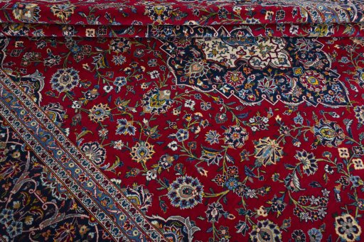 Close-up detail of 2000s Kashan rug from Iran / Persia showing Wool weave