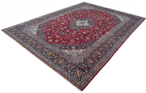 Corner detail of 2000s Kashan rug showing border pattern and Wool pile