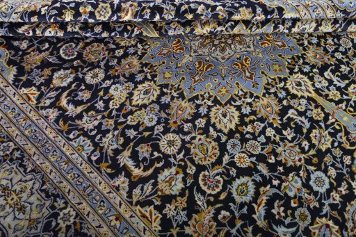 Close-up detail of 2000s Kashan rug from Iran / Persia showing Wool weave