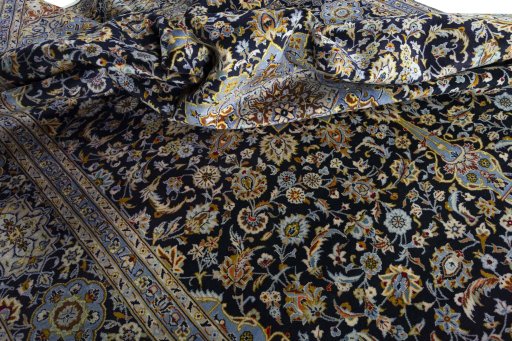 Surface texture of 2000s Kashan rug with natural Wool and intricate pattern