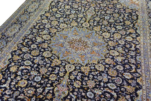 Backside of handmade 2000s Kashan rug showing knot structure and weave density