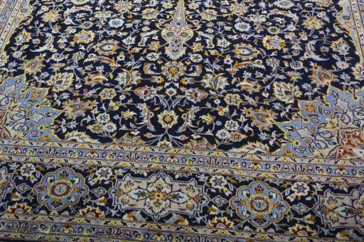Close-up detail of 2000s Kashan rug from Iran / Persia showing Wool weave