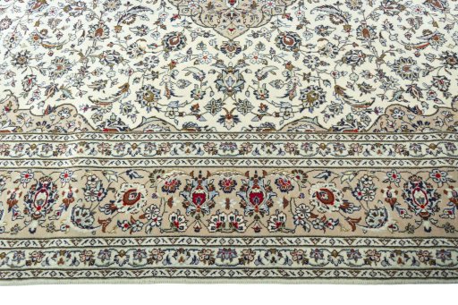 Corner detail of 2000s Kashan rug showing border pattern and Wool pile