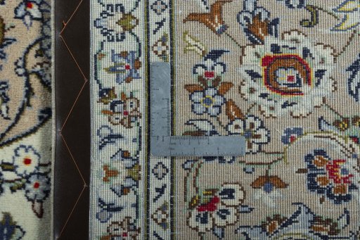 Backside of handmade 2000s Kashan rug showing knot structure and weave density