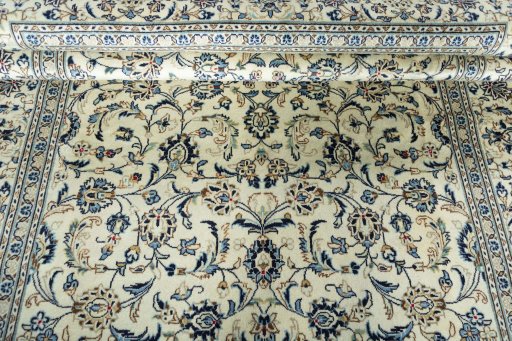 Backside of handmade 2000s Kashan rug showing knot structure and weave density