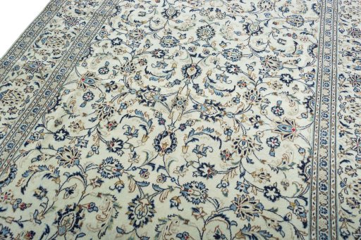 Backside of handmade 2000s Kashan rug showing knot structure and weave density