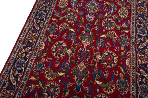 Backside of handmade 2000s Kashan rug showing knot structure and weave density