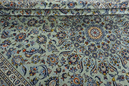 Close-up detail of 2000s Kashan rug from Iran / Persia showing Wool weave