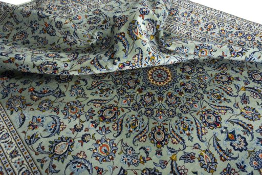 Surface texture of 2000s Kashan rug with natural Wool and intricate pattern