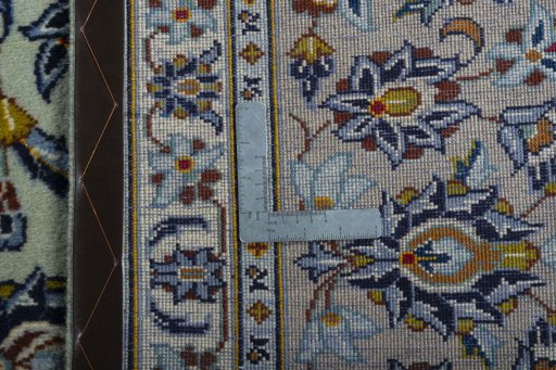 Backside of handmade 2000s Kashan rug showing knot structure and weave density