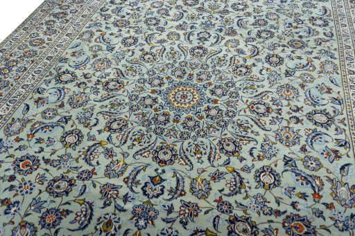 Backside of handmade 2000s Kashan rug showing knot structure and weave density