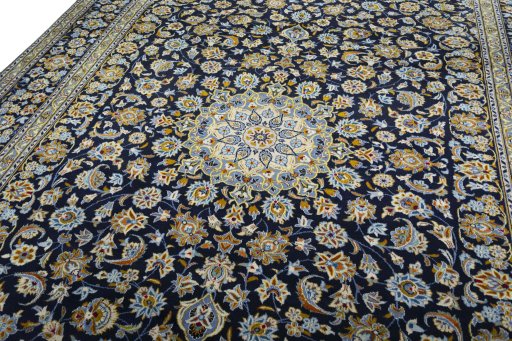 Backside of handmade 2000s Kashan rug showing knot structure and weave density