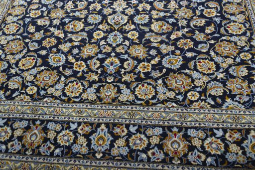 Close-up detail of 2000s Kashan rug from Iran / Persia showing Wool weave