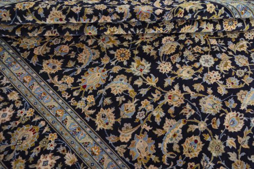 Close-up detail of 2000s Kashan rug from Iran / Persia showing Wool weave