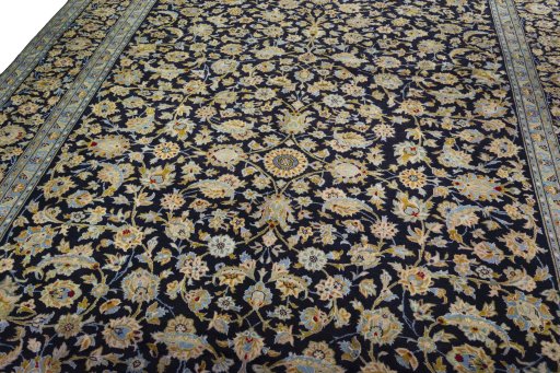 Backside of handmade 2000s Kashan rug showing knot structure and weave density