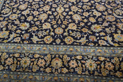 Close-up detail of 2000s Kashan rug from Iran / Persia showing Wool weave