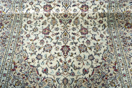 Close-up detail of 2000s Kashan rug from Iran / Persia showing Wool weave