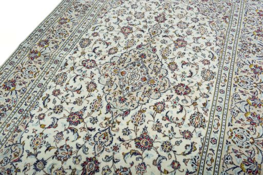 Backside of handmade 2000s Kashan rug showing knot structure and weave density