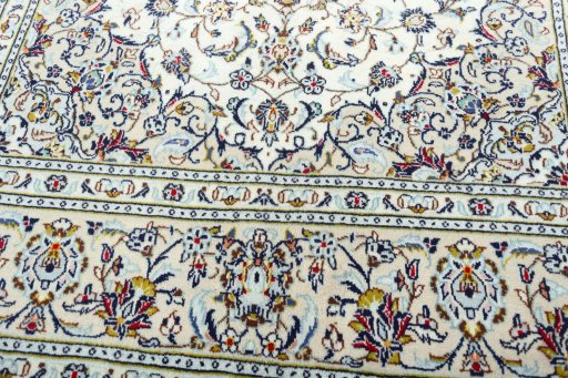 Close-up detail of 2000s Kashan rug from Iran / Persia showing Wool weave