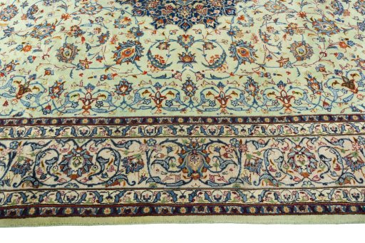 Corner detail of 2000s Kashan rug showing border pattern and Wool pile