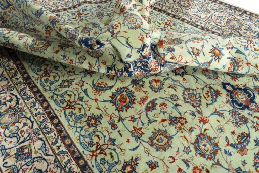 Surface texture of 2000s Kashan rug with natural Wool and intricate pattern