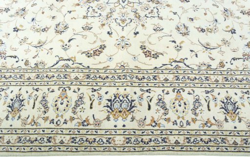 Corner detail of 2000s Kashan rug showing border pattern and Wool pile