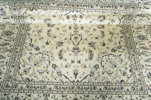 Close-up detail of 2000s Kashan rug from Iran / Persia showing Wool weave