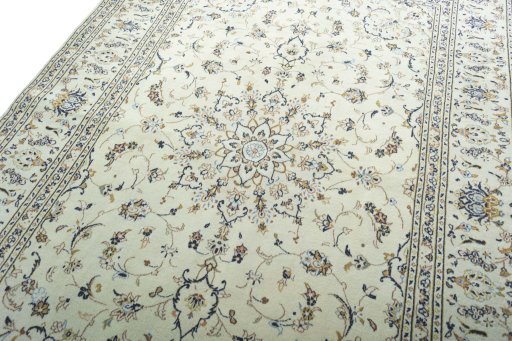 Backside of handmade 2000s Kashan rug showing knot structure and weave density