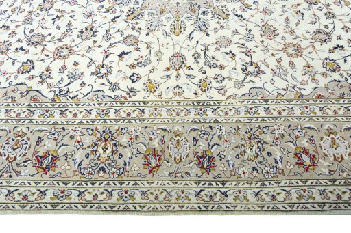 Corner detail of 2000s Kashan rug showing border pattern and Wool pile
