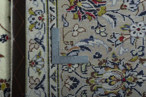Backside of handmade 2000s Kashan rug showing knot structure and weave density