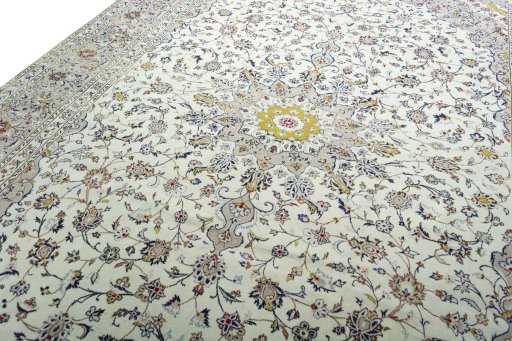 Backside of handmade 2000s Kashan rug showing knot structure and weave density
