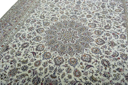 Backside of handmade 2000s Kashan rug showing knot structure and weave density