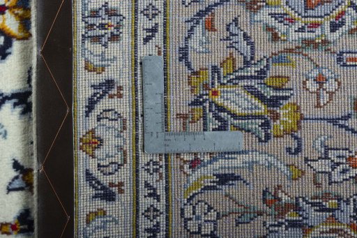 Backside of handmade 2000s Kashan rug showing knot structure and weave density