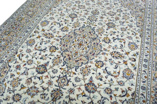 Backside of handmade 2000s Kashan rug showing knot structure and weave density